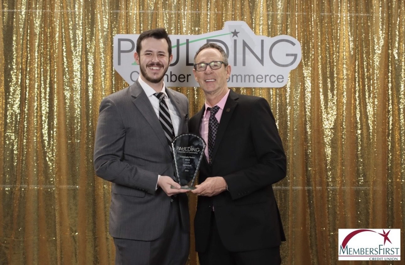 The iLuvMyGeek team accepting a Paulding Chamber of Commerce Community Partner Award in Dallas, GA